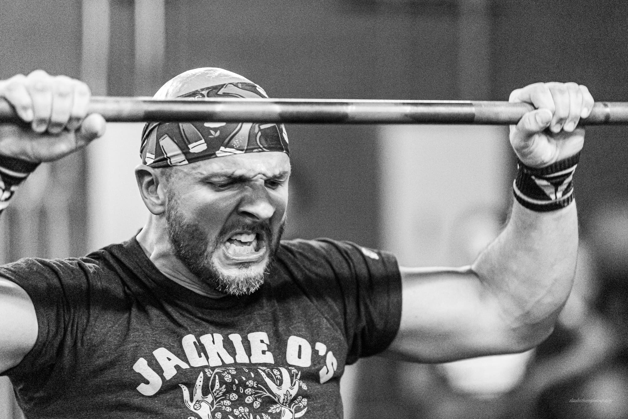 athlete excited after hitting barbell lift Best Workout Split for Maximum Muscle Gains