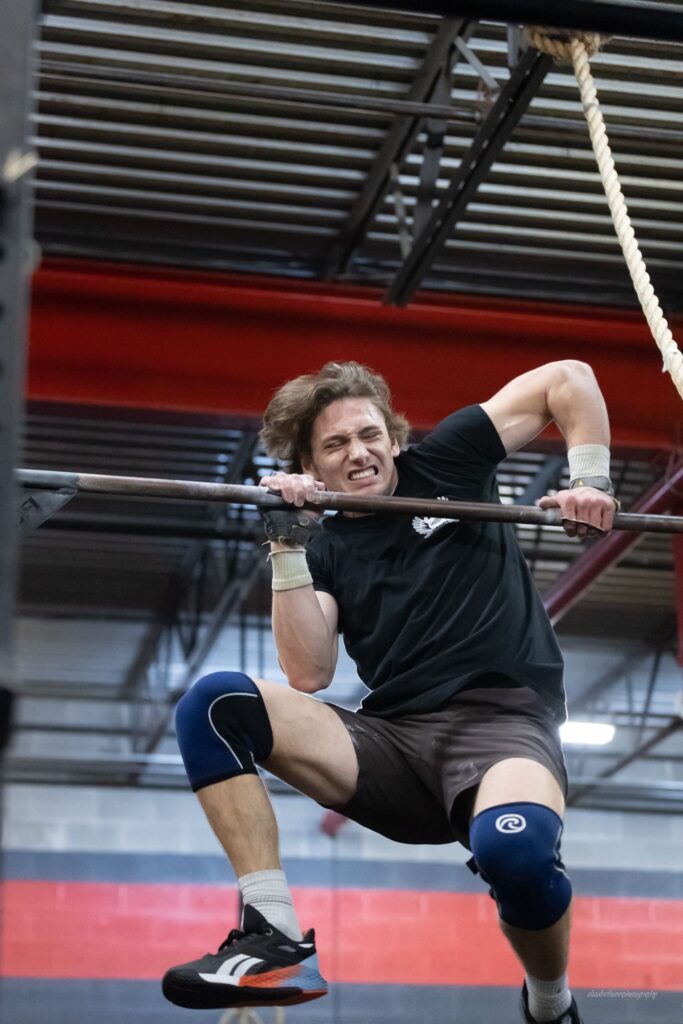 athlete struggles with bar muscle up but gives it full effort