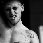 athlete struggles but grinds through crossfit open workout