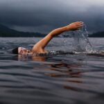 Person in lake swimming Fitness Challenges