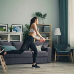 woman doing. a bulgarian split squat