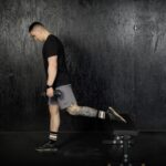 Man doing a bulgarian split squat