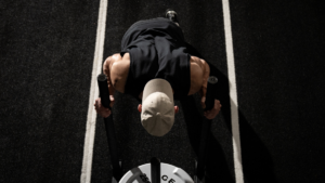 Man pushing sled in HYROX race