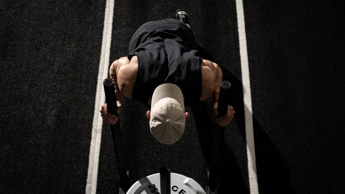 Man pushing sled in HYROX race